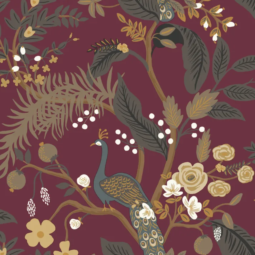 A repeating botanical and peacock pattern on a deep burgundy background, featuring a peacock, leaves, flowers, berries, and fruit in muted gold, olive, cream, and gray tones.